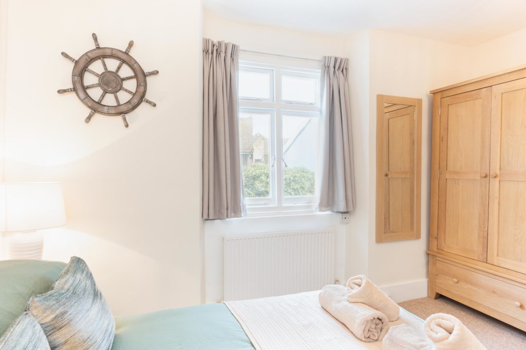 double bedroom with coastal decor by Jurassic Properties