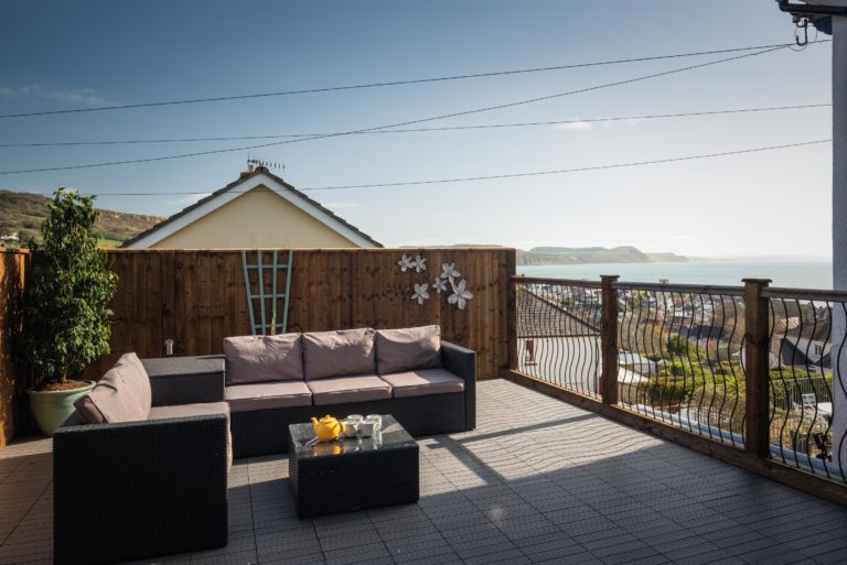 Private terrace overlooking Lyme Bay Dorset by Jurassic Properties in Lyme Regos
