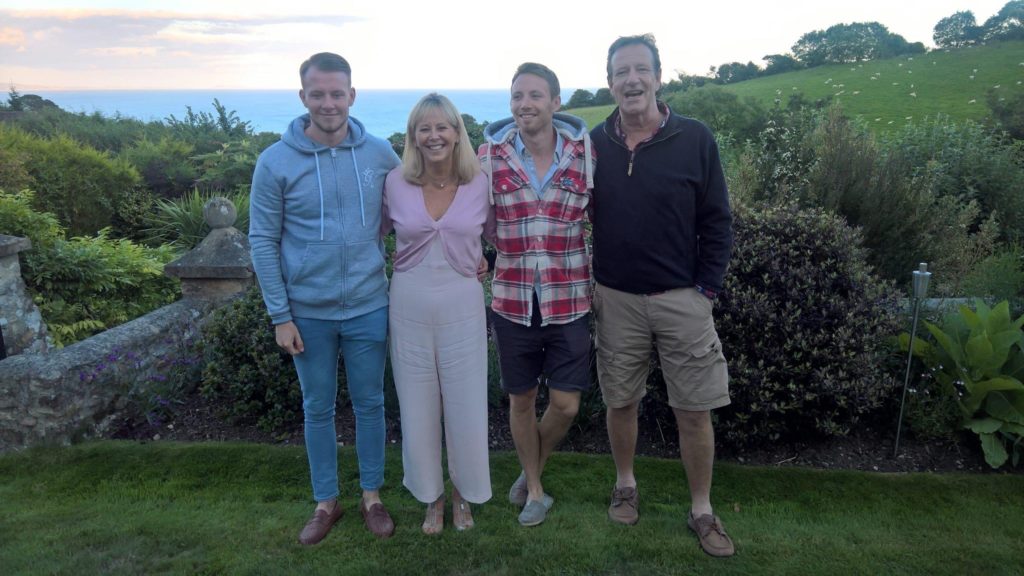 Jurassic Properties team photo with sea view in Lyme Regis