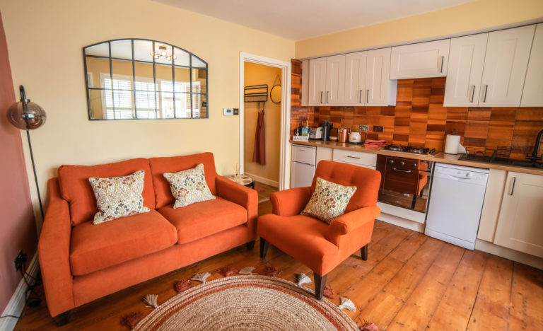 living room and kitchen of holiday cottage in lyme regis, dorset