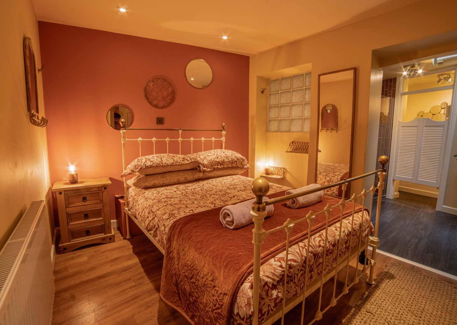 main bedroom with orange and cream interiors in dorset