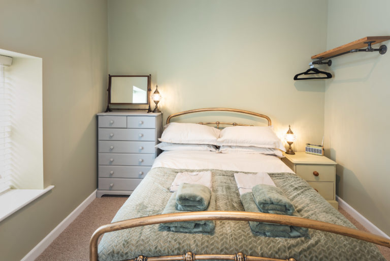 luxury bedroom of holiday cottage in lyme regis
