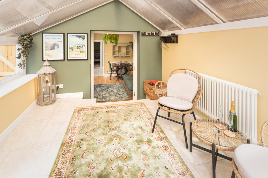 holiday cottage conservatory with rattan furniture