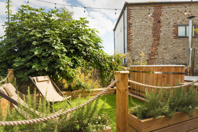 wood fired hot tub in lyme regis with sea views