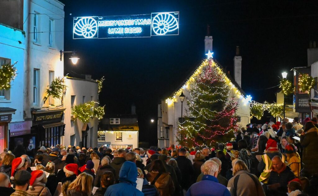 Carols Round The Tree Lyme Regis Broad Street Christmas 2025
